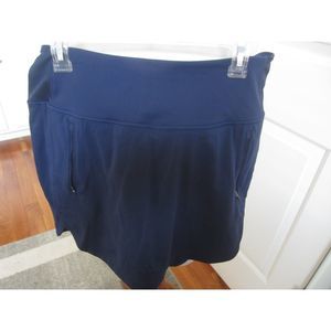 ATHLETA  NAVY FAIRWAY SKORT  16" ZIPPERED POCKETS SIZE LARGE